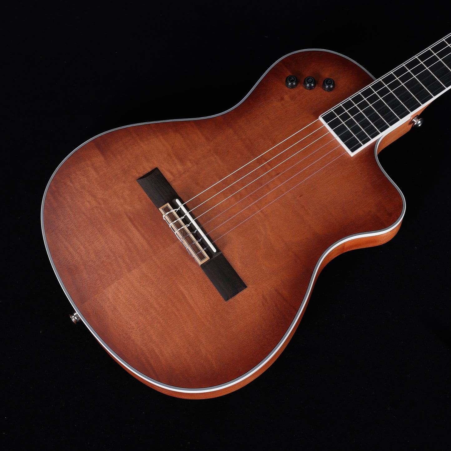 The 39-inch WINZZ WCG170CE sunburst guitar combines a thin body, nylon strings, and a vibrant finish to provide a smooth, full tone and elegant design for classical musicians.